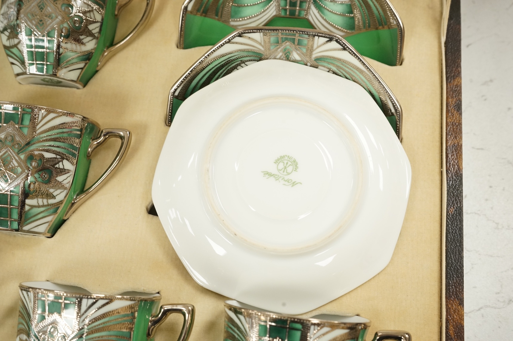 A Noritake coffee set, six-place setting including silver spoons, Sheffield 1932